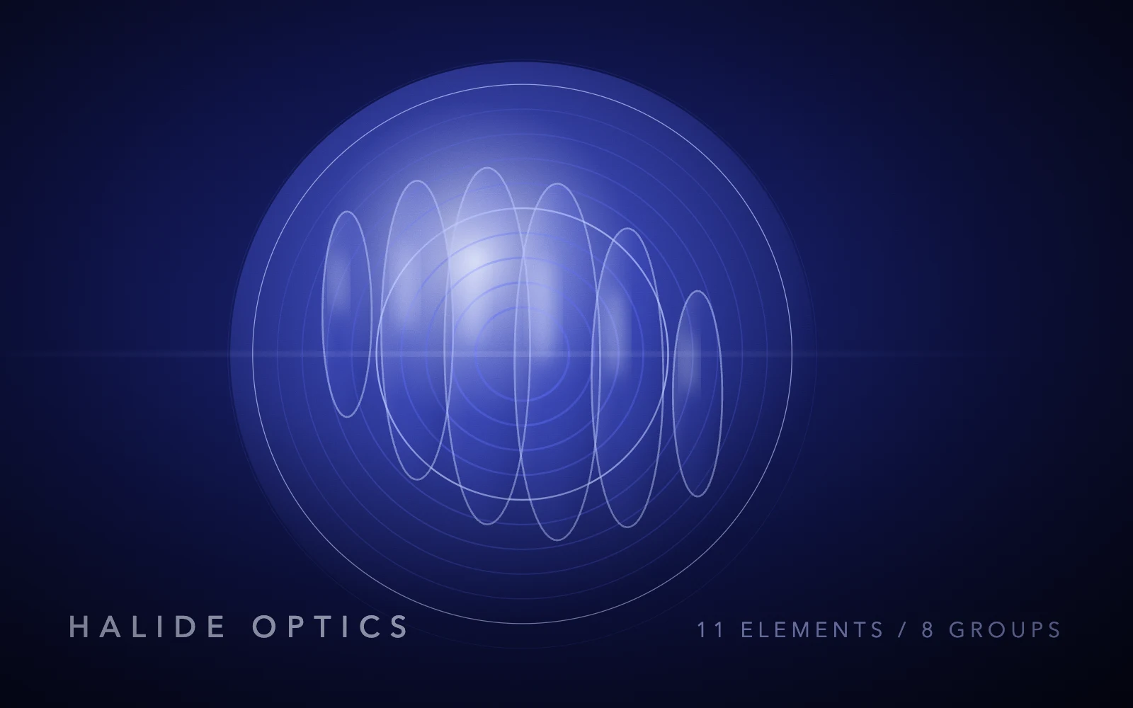 Concentric blue optical rings with a bright refracted highlight on a dark field.